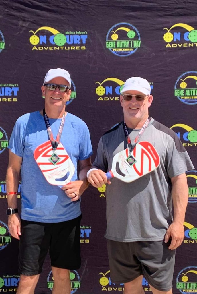 Scott and friend with their winning medal